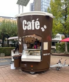 an outdoor coffee kiosk on the sidewalk