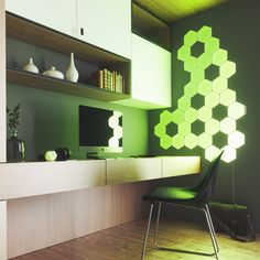 a room with green walls and white cabinets