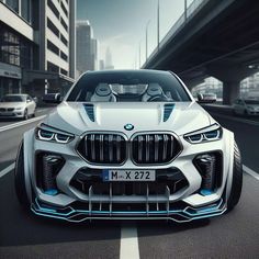 the bmw concept car is shown in front of an urban city street with cars driving on it