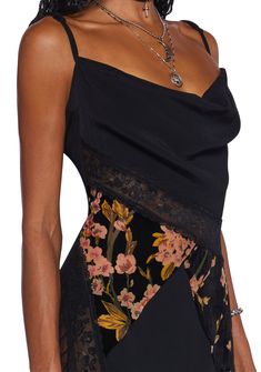 This midi dress has a chiffon, lace, and velvet construction, a patchwork design that includes a floral print and floral lace, a cowl neckline, adjustable shoulder straps, a back tie closure, and side zipper closures. Halloween Costume Boots, Grunge Dresses, Lace Clothes, Costume Boots, Witch Dress, Booties Outfit, Fairy Fashion, Velvet Lace, Black Doll