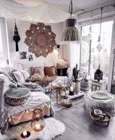 a living room filled with lots of furniture and decor