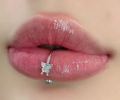 a woman's lips are covered in glitter and has a nose ring on it