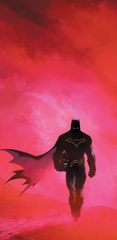 a man in a batman costume walking across a pink sky