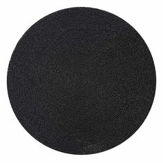 a round black placemat on a white background