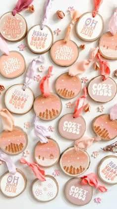 pink and white decorated cookies with words on them