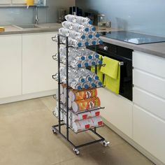 a stack of cans on a rack in a kitchen