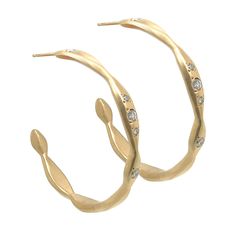 Large hand-carved and cast 14k gold hoops measure 30mm in diameter and create a playfully arranged series of shapes inspired by the rippling waters of the Aegean Sea. Each hoop contains three 2mm diamonds and two 1.3mm diamonds.  Stones: (4) 1.3mm and (6) 2mm diamondsMetal: 14k goldSize: 30mm diameter These earrings ar Aegean Sea, Gold Hoops, Carving, Gold