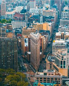 an aerial view of the city with lots of tall buildings