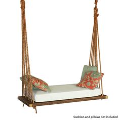 a swing bed with pillows on it and a pillow hanging from the backrests