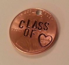 a close up of a penny with the words class of 2013 on it and a heart