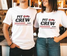 two people standing next to each other wearing t - shirts that say pit crew and mama