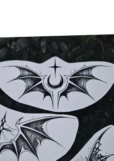 some stickers that are on the side of a car with bats and stars in them