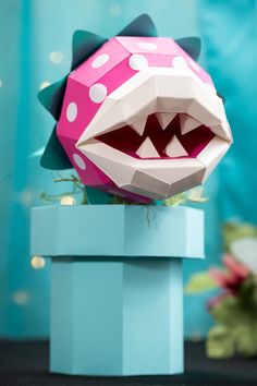 an origami monster with its mouth open