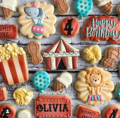 decorated cookies are displayed on a wooden surface with the words happy birthday written in large letters