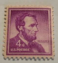 an old postage stamp with the image of abraham lincoln on it's back side