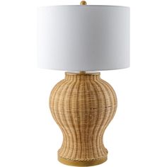 a wicker table lamp with a white shade on the base and a gold finish