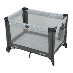 a baby crib that is sitting in the middle of a white background with black trim