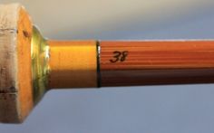 a close up view of the end of a wooden pencil with writing on it and an eraser