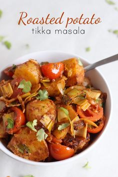 roasted potato tikka masala in a white bowl