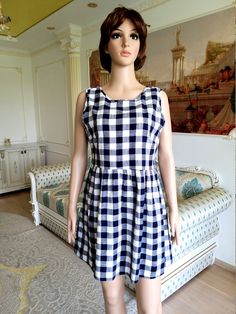 "womens dress plaid dress L Navy Blue dress Checkered dress boho dress beach dress skater dress oversize dress summer dress Babydoll dress 100% Cotton height of the woman in the photo - 180 cm Please refer to photos for details of condition. Condition: good vintage Measurements: Length: 81cm/31.9\" Bust: 100cm/39.4\" Waist: 90cm/35.4\" Hips: free Tag Size: UK-16; note The color on the pictures may vary due to monitor settings and light reflections. Ready to ship Please do not hesitate to contact Casual Plaid A-line Dress, Summer A-line Plaid Dress, Casual Plaid Dress For Beach, Casual A-line Plaid Dress, Gingham Cotton Mini Dress For The Beach, Gingham Cotton Mini Dress For Beach, Plaid Sleeveless Sundress For Beach, Plaid Sleeveless Sundress For The Beach, Blue Plaid Dress For Summer Picnic