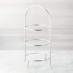 three tiered metal rack on marble counter top