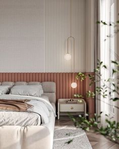 a white bed sitting next to a window with green plants growing on top of it