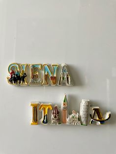 two magnets with the word new york and an eiffel tower on them