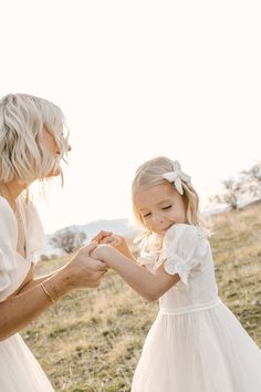 A real life princess dress for your little love. Delicate dotted white tulle that will have them twirling the day away, our Ballerina Dress is one of a kind. And let's not forget the darling puff sleeves, ribbon waistband and back zipper. Also available in ADULT sizes. Kids White Dress, Real Life Princesses, Fairytale Party, Thanksgiving Dress, Girls Holiday Dresses, Ballerina Dress, White Dress Party, Holiday Party Dresses, White Tulle