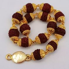 Fabulous handmade 22karat genuine lab tested or 916/22k hallmarking bracelet with natural rudraksha beads indian jewelry  metal: 22k yellow gold bracelet  size 7.5",8.0",8.5",9" approx. weight-8.500 grams approx. Brand-handmade. material-gold, natural rudraksha beads. makes excellent gift item and collection piece  condition: excellent condition - brand new. for more information please see the photo's gold jewelry is handmade designer jewelry. so, there can be slight difference in size and weigh Rudraksha Jewelry, Rudraksha Bracelet, Rudraksha Beads, Photo Gold, Designer Handmade Jewellery, Jewelry Metal, Beads Handmade, Yellow Gold Bracelet, Handmade Bracelet