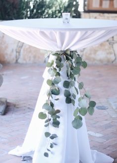 an image of a table with greenery on it