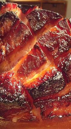 a large piece of meat sitting on top of a wooden cutting board