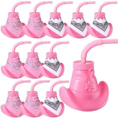 pink baby pacifiers with bandana on them are lined up and ready to be used