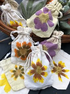 several bags with flowers on them sitting next to each other