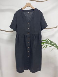 "This linen midi dress is a perfect example of beauty in simplicity. Made from breathable and soft linen, just right below the knee length, back tie at the neck line, this classic piece is such a no-brainer go to item. - Handmade with 100% medium weight linen - Short sleeves - Scoop neck - Button down front - Below the knee length or customized length per request Please provide your shoulder width, full bust measurement ( measured around the fullest part ) and your height in the note to seller b Midi Linen Dress, Button Down Midi Dress, Linen Midi Dress, Linen Short, Dress Midi, Button Down Dress, Button Dress, Dress Short, Linen Dress