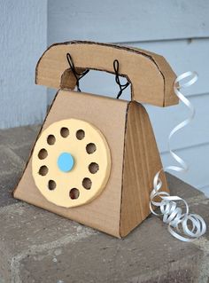 an old fashioned phone made out of cardboard