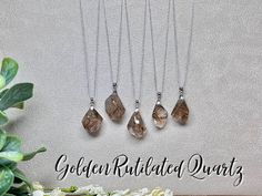 Stone: Golden Rutilated Quartz  Shape:  Freeform Color: Clear/Gold  Clasp:  925 Silver  #1:  1.00" x 0.82" #2:  1.08" x 0.77" #3:  1.06" x 0.80" #4:  1.04" x 0.59 #5:  1.01" x 0.65" Rutilated Quartz - clear quartz riddled with needle-like pieces of golden Rutile, a material made of titanium dioxide that are also known as "The Hairs of Venus". Rutilated Quartz can clear energy blockages from all of the chakras, and attune one to their Divine Purpose.  Rutilated Quartz puts off an exceptionally hi Clear Energy, Divine Purpose, Rutilated Quartz Crystal, Golden Rutilated Quartz, Rutile Quartz, Titanium Dioxide, Moonstone Pendant, Rutilated Quartz, Quartz Stone