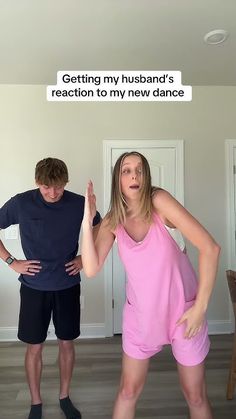 a man and woman standing next to each other in front of a white wall with text on it that reads getting my husband's reaction to my new dance