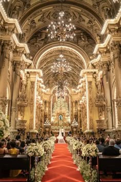 the bride and groom are sitting at the alter