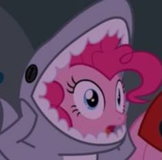 the pinkie is wearing a shark suit and holding a red object in her hand