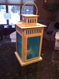 a decorative lantern sitting on top of a table