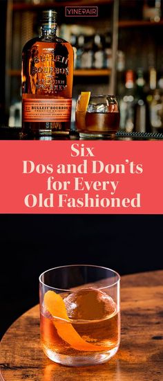 an old fashioned whiskey with orange slices on the table and in front of it, there is