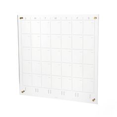 a white wall calendar with gold numbers on it