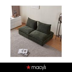 a green couch sitting on top of a carpeted floor