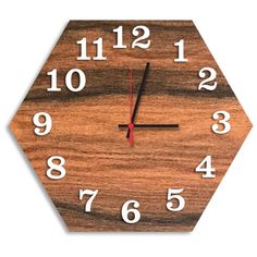 a wooden clock with white numbers on it