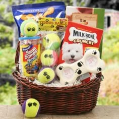 a basket filled with toys and snacks on top of a table