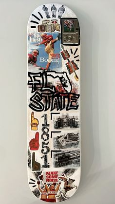 a skateboard with many stickers on it