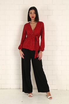 "The red sequined wrap blouse has a modern and stylish look. Our glamorous blouse with its sparkle is an extremely stylish and elegant choice for formal evenings such as cocktails, weddings and all-night/day invitations. The blouse, which is a coupon piece that you should have in your closet, can be combined with sequined twin trousers, baggy and tight classic trousers or jeans. It easily adapts to your body with the shawl model. It is tied around the waist with a belt. S/36 Length from underarm: 43cm/16.9\" Length from Shoulder: 66cm/25.9\" M/38 Length from underarm: 44cm/17.3\" Length from Shoulder: 67cm/26.4\" L/40 Length from underarm: 45cm/17.7\" Length from Shoulder: 68cm/26.8\" XL/42 Length from underarm: 46cm/18.1\" Length from Shoulder: 69cm/27.2\" 2XL/44 Length from armpit: 47cm/ Glamorous V-neck Tops For Date Night, Glamorous V-neck Top For Parties, Glamorous Formal V-neck Blouse, Elegant V-neck Holiday Tops, Glamorous V-neck Cocktail Tops, Elegant V-neck Tops For Festive Occasions, Fitted Sequined V-neck Blouse, Fitted V-neck Sequin Blouse, Festive V-neck Evening Blouse