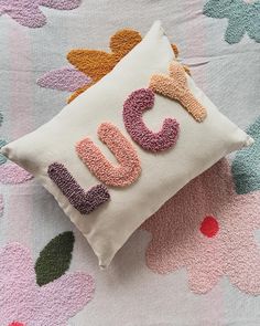 a pillow that has the word love on it