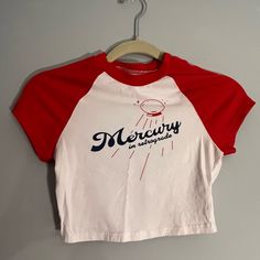 Crop Top Baseball Tee Red And White With Navy Blue Writing Never Used Red Retro Top With Graphic Print, Retro Red Top With Letter Print, Red Fitted Retro T-shirt, Red Graphic Tee With Letter Print, Retro Red Crew Neck Top, Red Cotton Tops With Letter Print, Red Cotton Top With Letter Print, Sporty Red Shirt For Summer, Retro Red Crew Neck Shirt