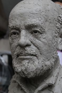 a close up of a clay sculpture of a man